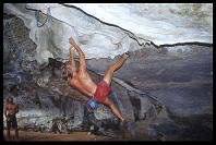 David Benson bouldering "By Way of Deception" (7a) for the camera.