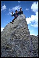 David Oka and David Benson on the summit of Shark's Nose (5.8). Wind River Range, Wyoming