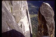 The fun doesn't end when the climbing stops on the Lost Arrow Spire. David Benson doing the tyrollean traverse back to the valley rim. Yosemite, California